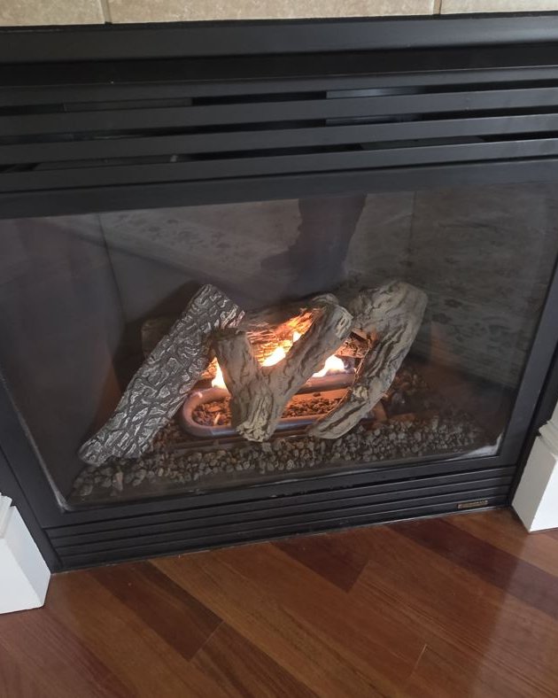 Same gas fireplace clean and burning brightly after service