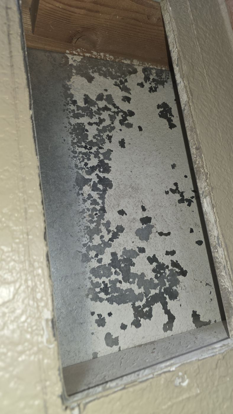 Vent duct boot with heavy dust and mold-like staining before cleaning