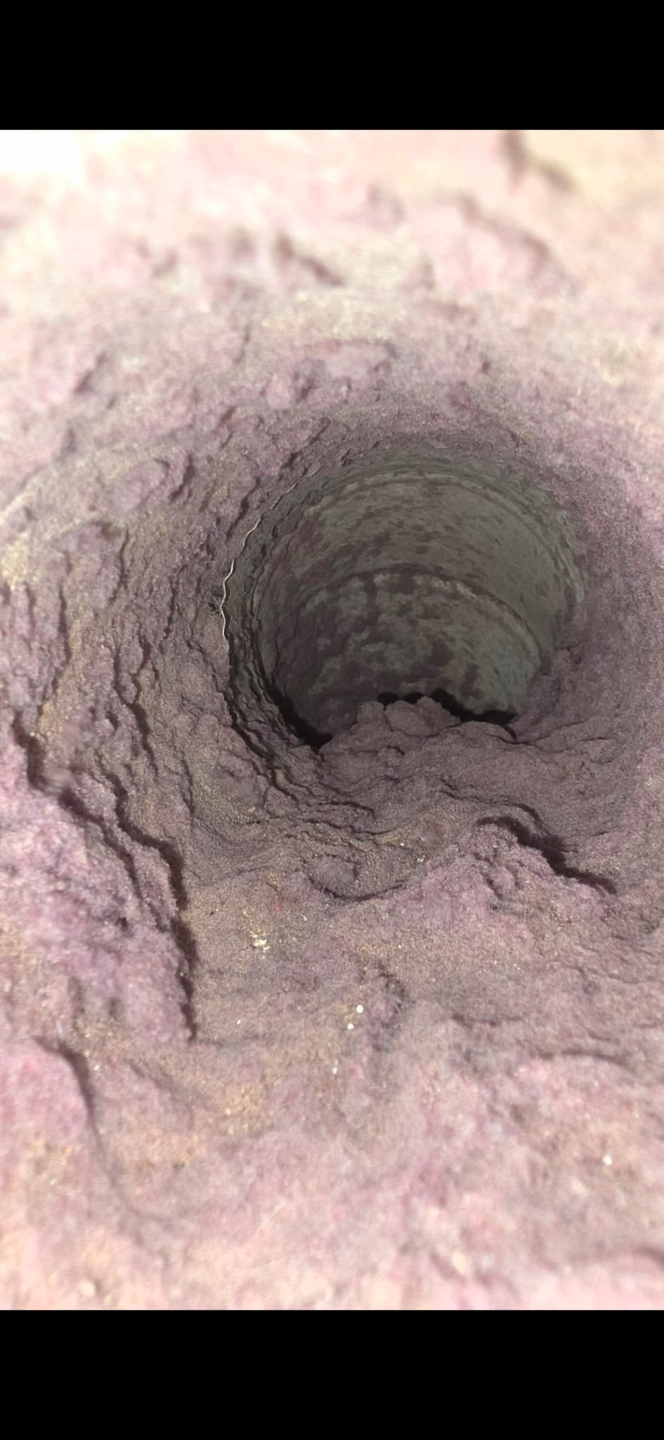 Heavily compacted lint filling a dryer vent line